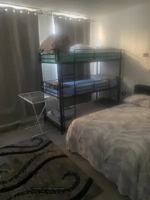 a bedroom with two bunk beds and a bed at Big beautiful appartement in center of Antwerpen in Antwerp