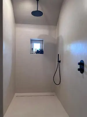 a bathroom with a shower with a window at De Middenblijk in Turnhout
