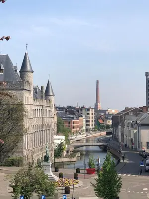 a view of a city with a river and a building at Rietveldhouse Gent in Ghent