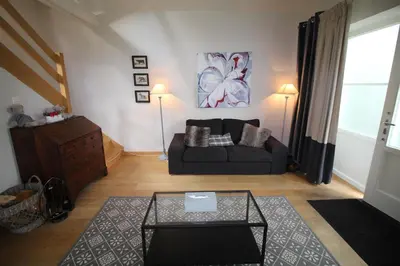 a living room with a couch and a table at Casa Terlinden in Brussels