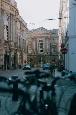 a large building with cars parked in front of it at Kouter House in Ghent