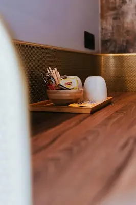a bowl of kitchen utensils on a wooden table at Kouter House in Ghent