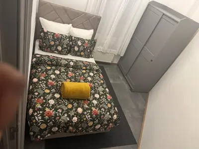 an overhead view of two beds in a hotel room at La Perla Appartements Louise in Brussels