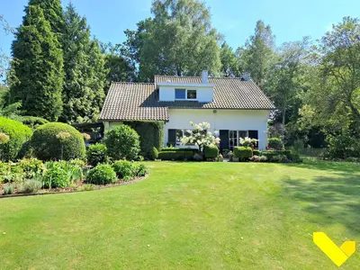 a house with a lawn in front of it at Wezelhoeve in Mol