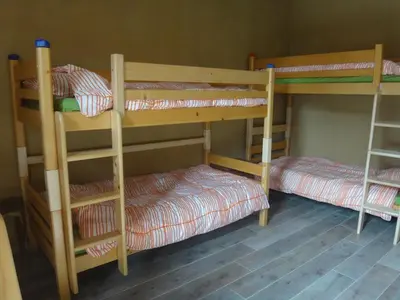 two bunk beds in a room with at Aan de Jordaan in Boutersem