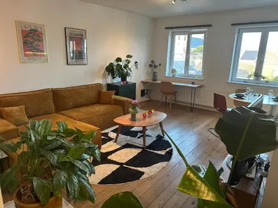 a living room with a couch and a table at Antwerp City Nest in Antwerp