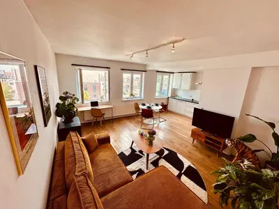 a living room with a couch and a table at Antwerp City Nest in Antwerp