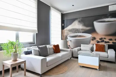 a living room with two couches and a table at Relax Ohm in Zottegem