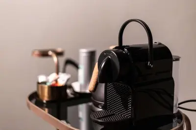 a coffee maker is sitting on a table at Porta Superia Boutique B&B in Mechelen