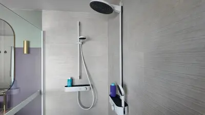 a shower in a bathroom with a shower head at B&B Sleep140 in Assenede