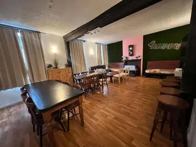 a restaurant with tables and chairs and a dining room at Sweet home in Ghent