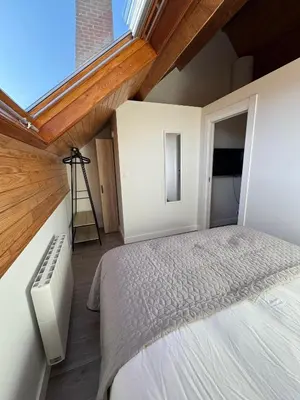 a bedroom with a bed and a window at WelKom Studios in Zaventem