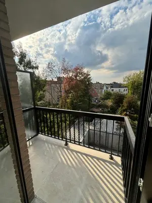 a balcony with a view of a city at Luxury 1 Bedroom Apartment with Sofa Bed & Balconies Prime Location near ING Arena, Expo 12 & Atomium in Wemmel