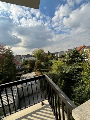 a balcony with a view of a city at Luxury 1 Bedroom Apartment with Sofa Bed & Balconies Prime Location near ING Arena, Expo 12 & Atomium in Wemmel