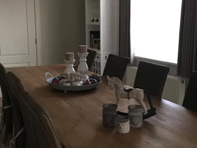 a dining room table with a bowl of food on it at Guesthouse De Middelvelden in Arendonk