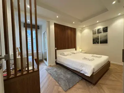 a bedroom with a large white bed and a window at Hotel Room - Centrum Ghent Leie in Ghent