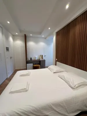 a bedroom with a large bed with two towels on it at Hotel Room - Centrum Ghent Leie in Ghent