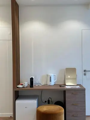 a desk with a laptop computer and a stool at Hotel Room - Centrum Ghent Leie in Ghent