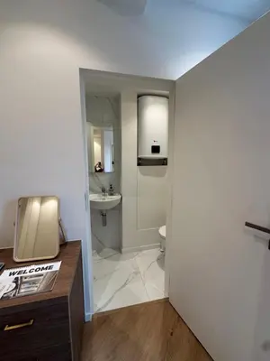 a bathroom with a toilet and a sink at Hotel Room - Centrum Ghent Leie in Ghent
