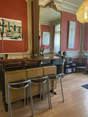 a dressing room with a mirror and two chairs at Prinsenhof in Ghent