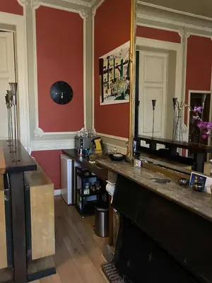 a room with a large mirror and a table at Prinsenhof in Ghent
