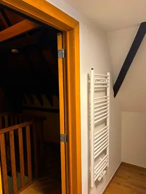 an open door with a radiator in a room at Family Heritage Grand Place in Brussels