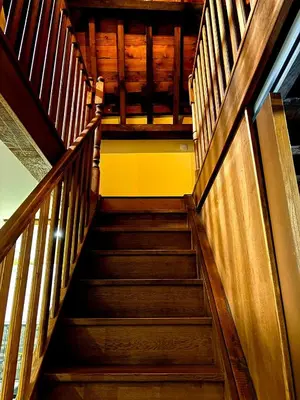 a staircase in a building with wooden railings at Family Heritage Grand Place in Brussels