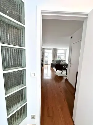a white room with a room with a wine cellar at Wonderful apartment in Sablon in Brussels