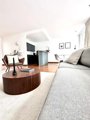 a living room with a couch and a coffee table at Wonderful apartment in Sablon in Brussels