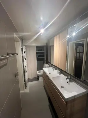 a bathroom with a sink and a toilet at Midi Tracks Apartment in Brussels