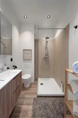 a bathroom with a shower and a toilet and a sink at Cosy 2-Room Apartment for 4 Guests near Gent Sint-Pieters Station, and Close to the City Centre in Ghent