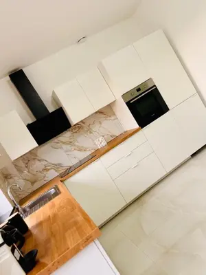 a kitchen with a sink and a counter top at Skyline Duplex Brussels Parking Fibre Modernité in Brussels