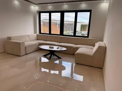 a living room with a couch and a table at Skyline Duplex Brussels Parking Fibre Modernité in Brussels