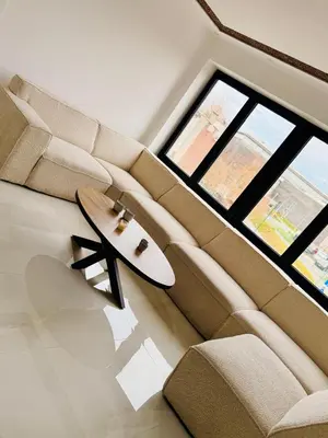 a living room with a couch with a surfboard on it at Skyline Duplex Brussels Parking Fibre Modernité in Brussels