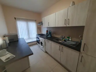 a kitchen with a sink and a washing machine at Laaglandlaan 1 in Antwerp