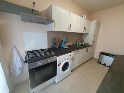 a kitchen with a stove and a washing machine at Laaglandlaan 1 in Antwerp