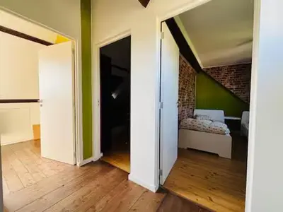 a room with an open door to a room with a bed at Entire house with excellent accessibility in Machelen