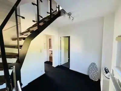 a staircase in a room with a white wall at Entire house with excellent accessibility in Machelen