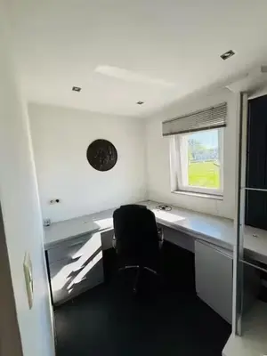 an office with a chair and a desk and a window at Entire house with excellent accessibility in Machelen