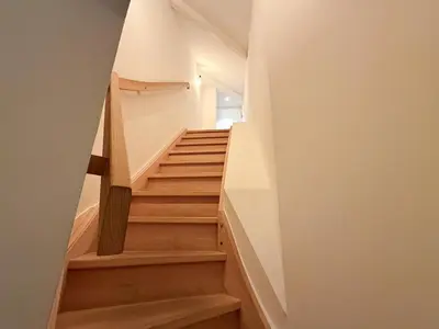 a staircase in a house with wooden floors at Studio 204 cosy au centre de Bruxelles in Brussels