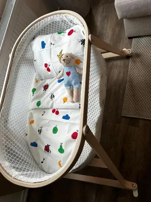 a stuffed teddy bear sitting in a high chair at Lovely 1BR & 1LR Apartment, Only 15 Min Walk to City Center in Ghent