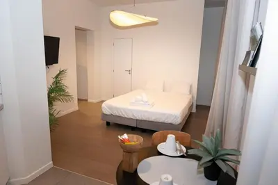 a small room with a bed and a table at Studio 402 Avenue Louise in Brussels