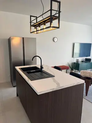 a kitchen with a sink and a counter top at Luxury Apartment Antwerp Port Moerbeke 2 in Lokeren