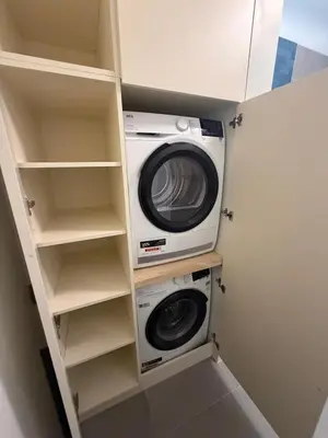 a laundry room with a washer and dryer in it at Luxury Apartment Antwerp Port Moerbeke 2 in Lokeren
