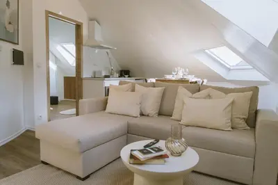 a living room with a couch and a table at Cozy 1BR & Living Room Apartment, Just 15 Minutes to Downtown in Ghent