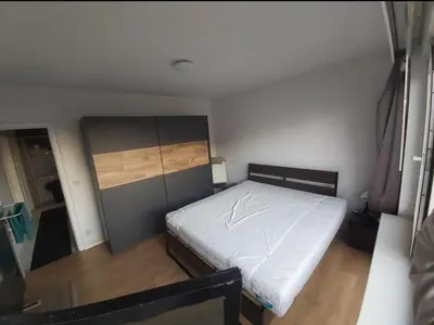 a small bedroom with a bed in a room at akros comfort and relax in Antwerp