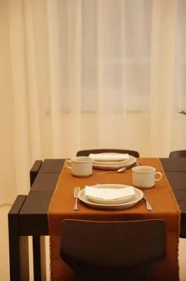 a table with plates and utensils on top at A Place - Boutique Hotel - Meir 24 in Antwerp