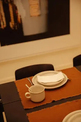 a table with a plate and a cup on it at A Place - Boutique Hotel - Meir 24 in Antwerp
