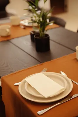 a table with a plate with a napkin on it at A Place - Boutique Hotel - Meir 24 in Antwerp