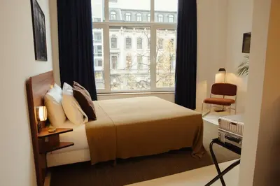 a hotel room with a bed and a window at A Place - Boutique Hotel - Meir 24 in Antwerp